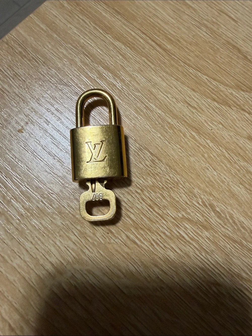 Louis Vuitton Gold Padlock Keyed Accessory